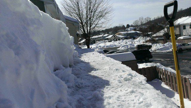 Deep snow shoveled off a roof